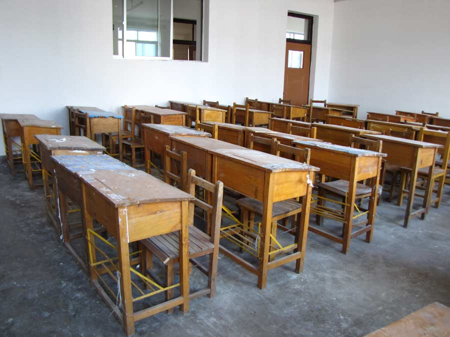These desks are waiting for replacement, Xin-Min senior school