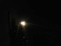 В темноте. К сожалению налобный светодиодный фонарь здесь мало помогает, потому что не дает теней. Время под землей замирает и остается только надеяться, что эта труба все-таки где-то кончится.