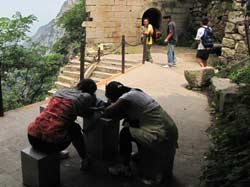 Like many other sacred places, Hua Shan is also a big tourist center which attracts lots of religion seekers. Most of the climbers get to the summit by a cable road, but these youngsters prefer the traditional way.